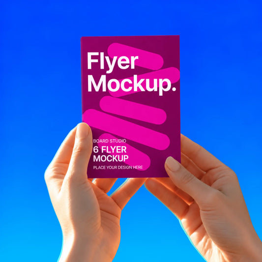 A6 flyer held in two hands against a blue background
